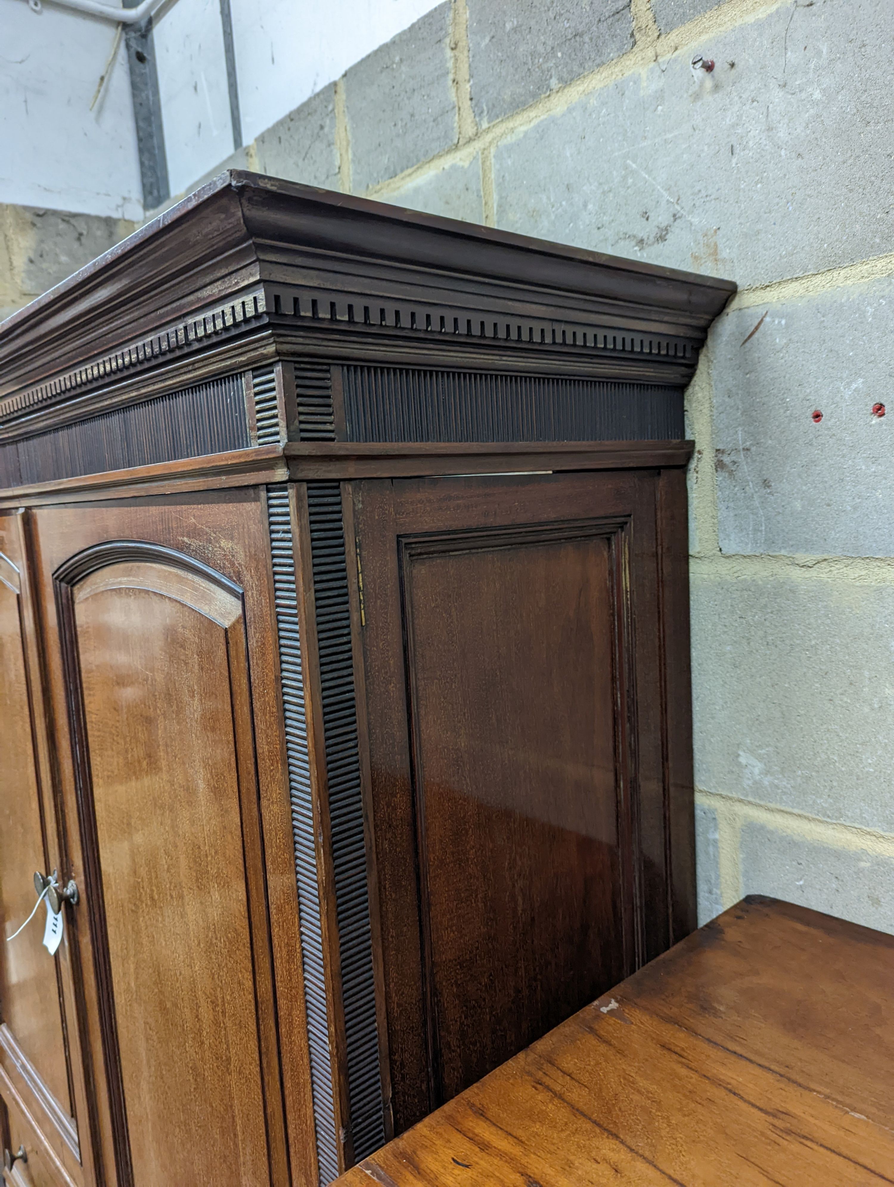 A late Victorian mahogany press cupboard (altered), width 114cm, height 182cm